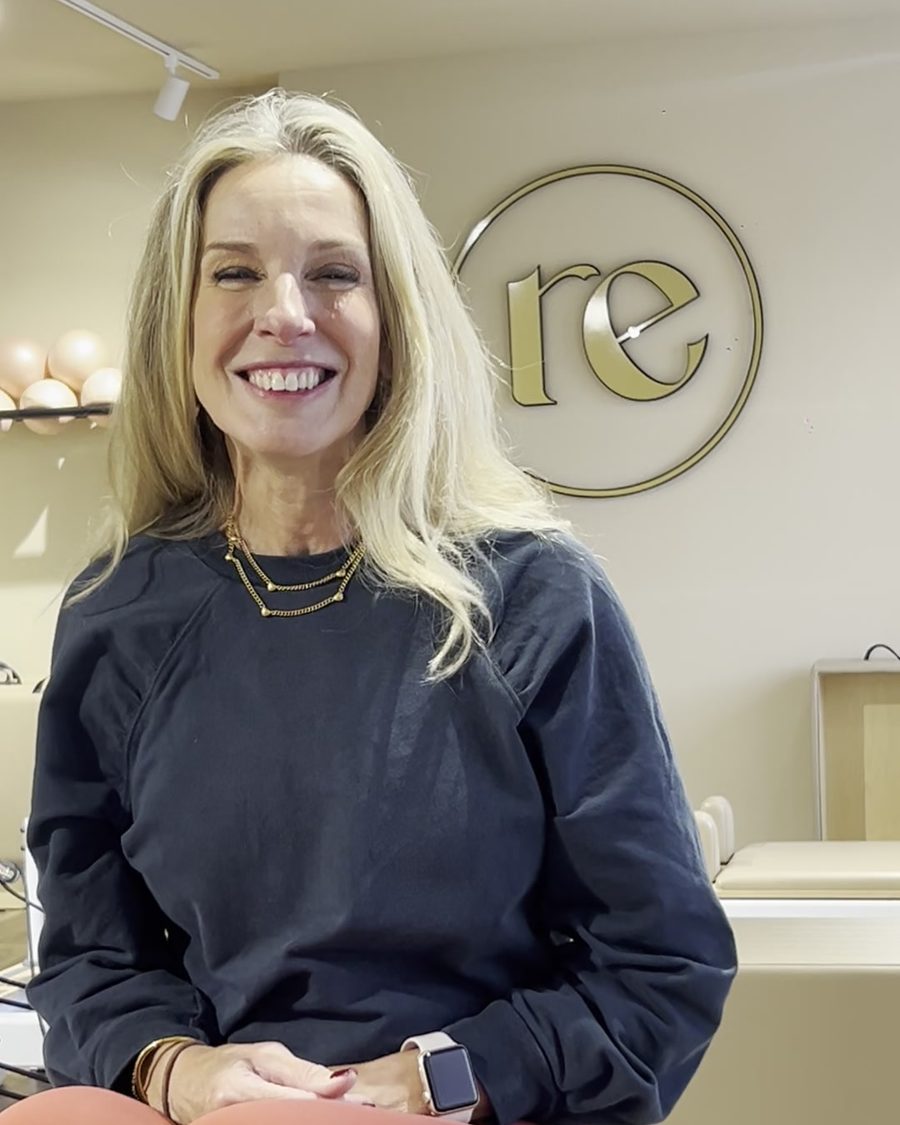 Mandy Newlove smiling on the reformer